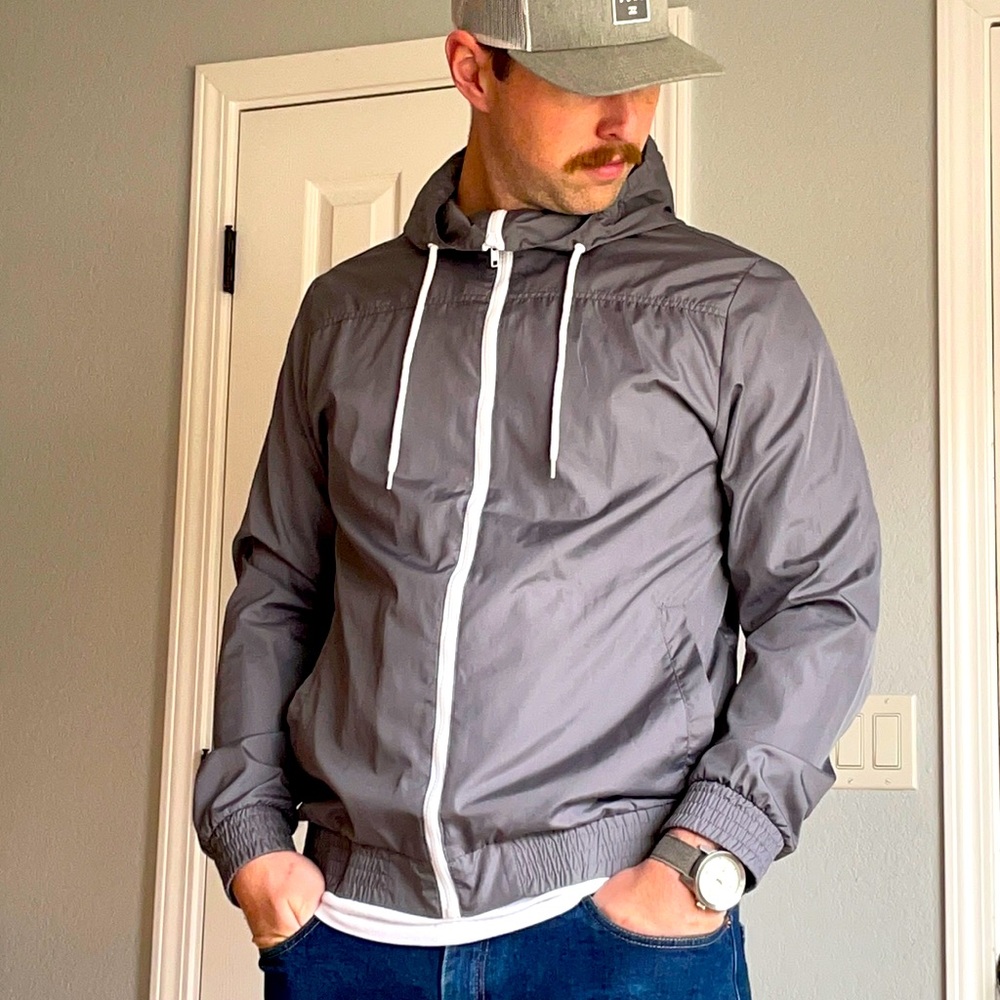 Grey wind breaker. Worn 1-2 times. No rips. No stains